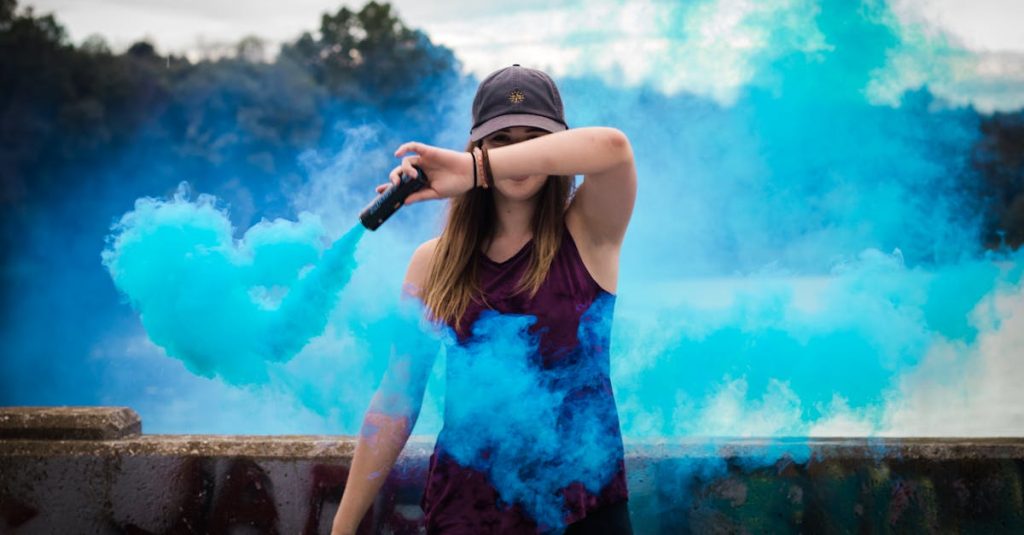 Woman Holding Blue Smoke Flare